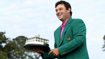 Reed thwarts challengers, wins Masters