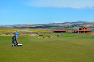 Whipping down the 18th fairway on the Golf Board with the Gamble Sands pro shop and restaurant in the background